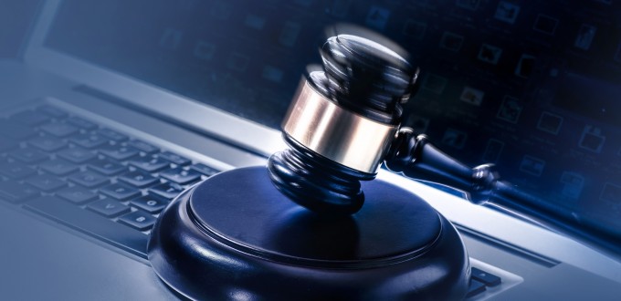 Gavel on computer legal law background